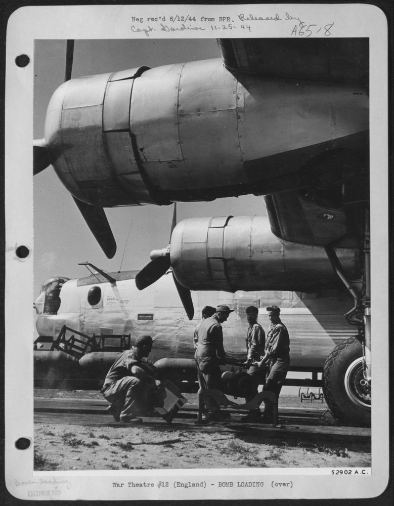 500-pounders Are Lifted by Hand by Ordnance Crew from Bomb Trailer