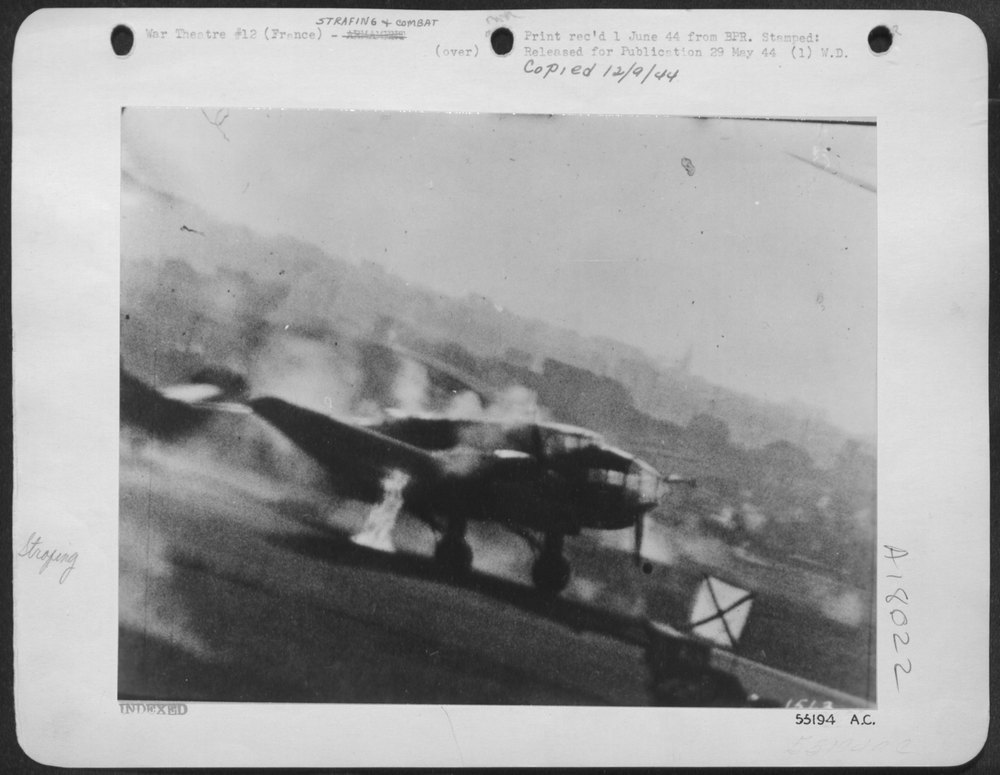 8th AAF fighter plane over Nazi airbase