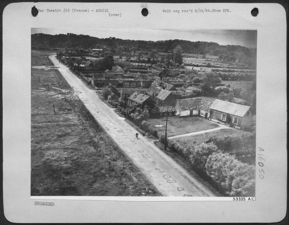 8th Air Force Plane over French village