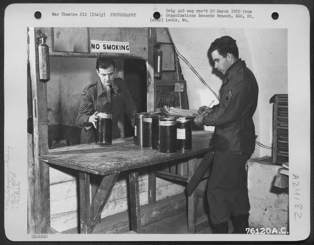 A British Soldier Assists An American Enlisted Man, of the 90th Photo