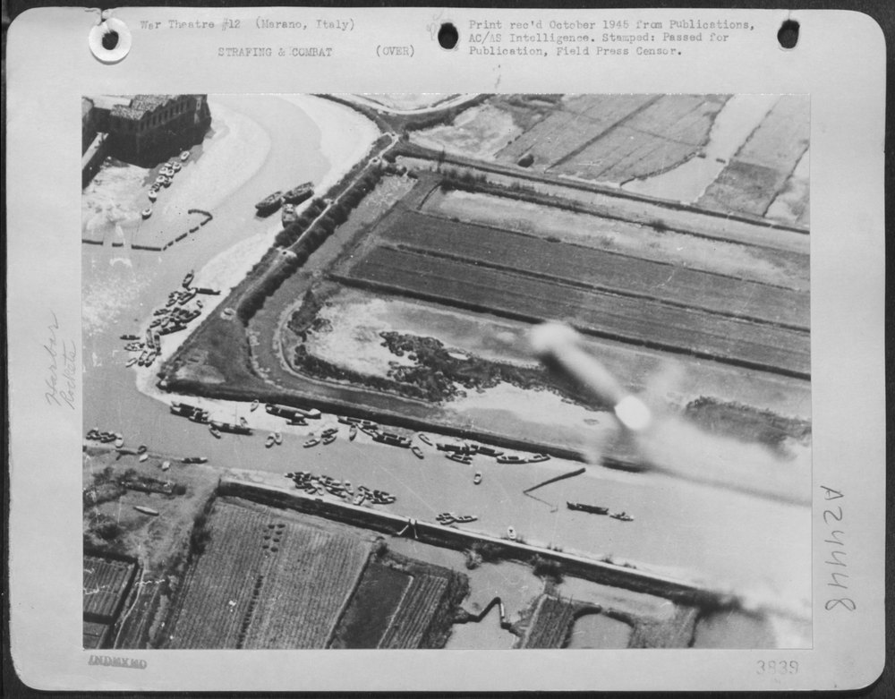 A rocket from an aircraft of the Desert Air Force, heads for barges