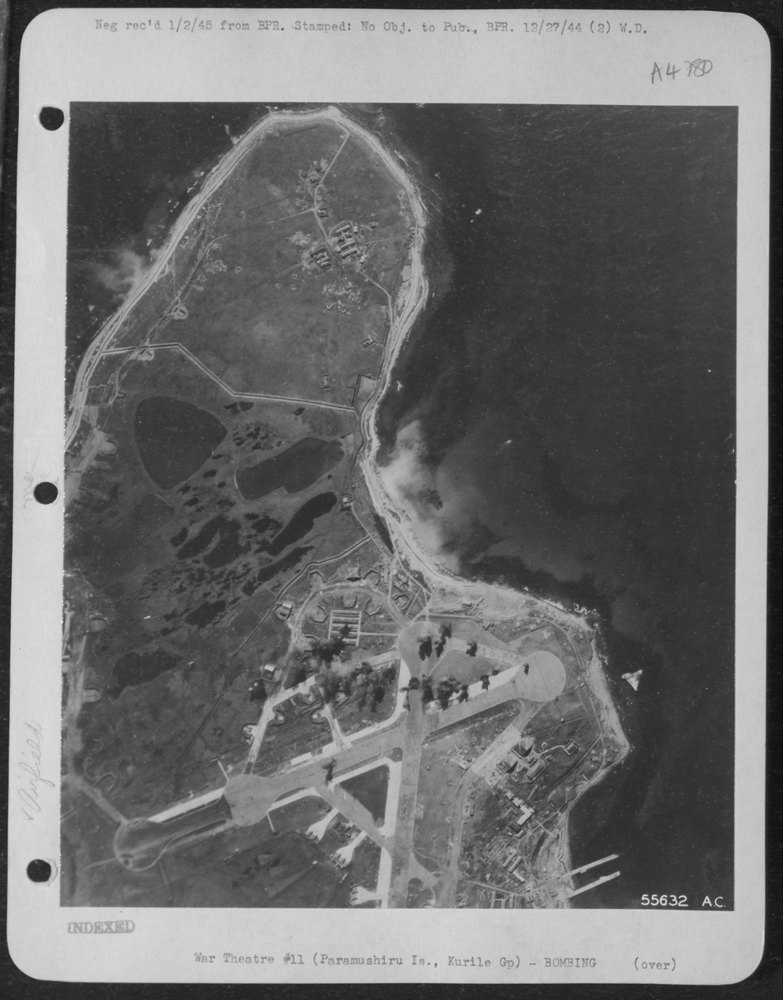 A String of Bombs from an 11th Air Force Liberator Explode Along