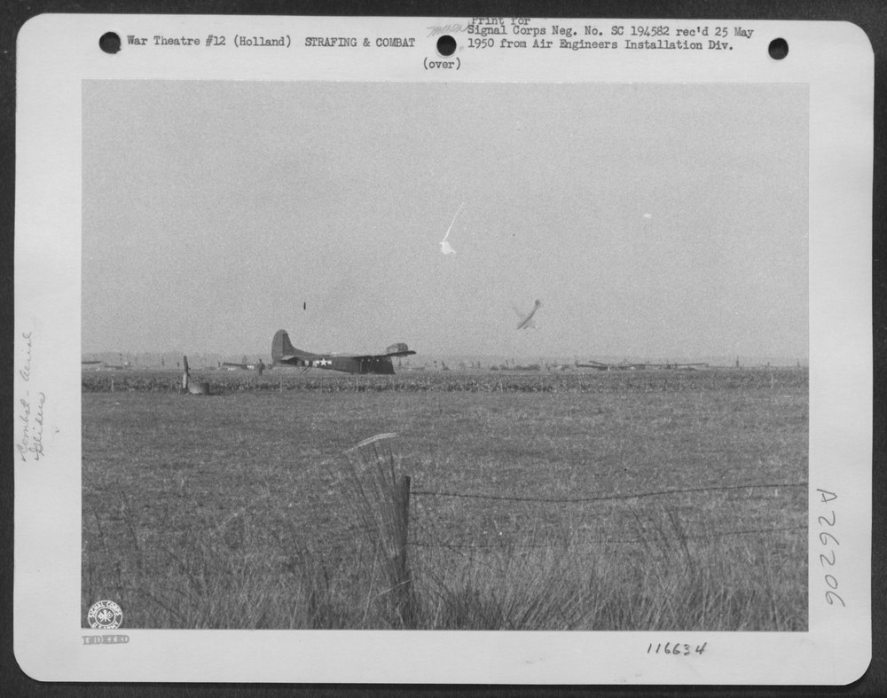 A troop transport, right, plunges to earth in Holland during landing