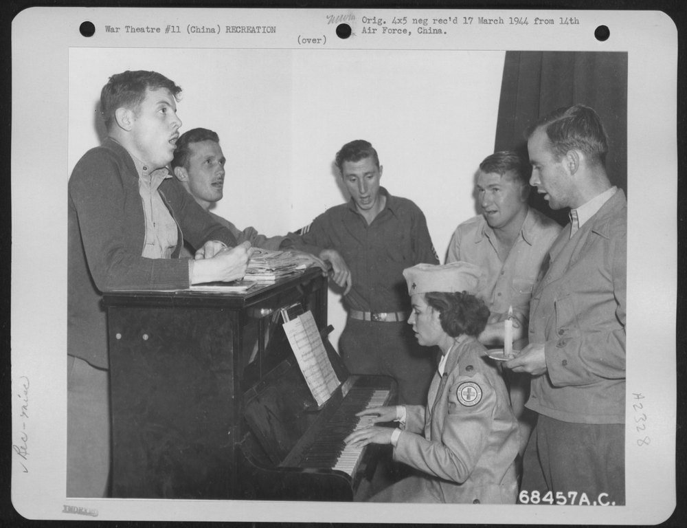 Accompanied by a Red Cross Woman a Quintet of 14th Air Force Men