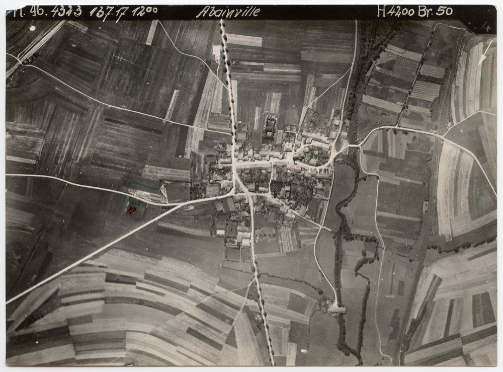 Aerial photograph of Abainville with barracks and vehicles