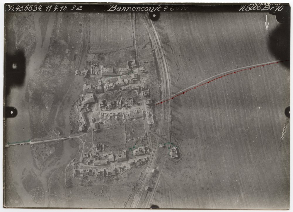 Aerial photograph of village with damaged buildings