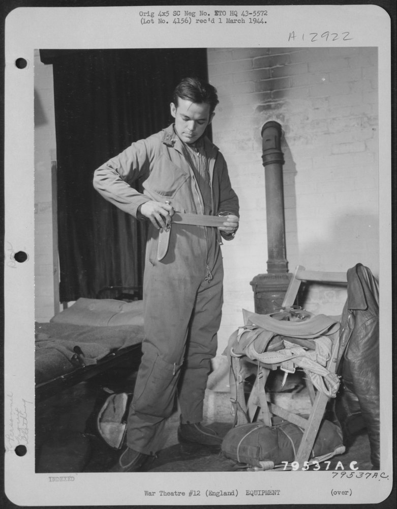 After donning the electrically heating flying suit, S/Sgt. William W.