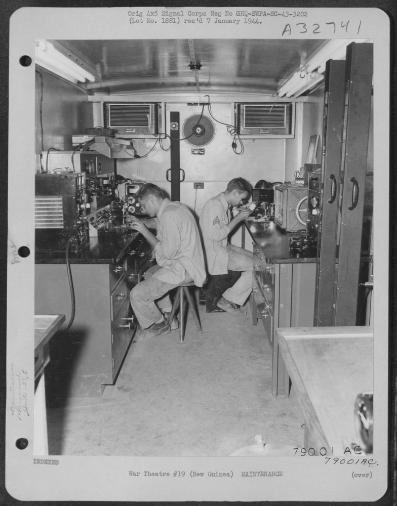 Albert Buford works at the electrical testing equipment and Sgt. Bill
