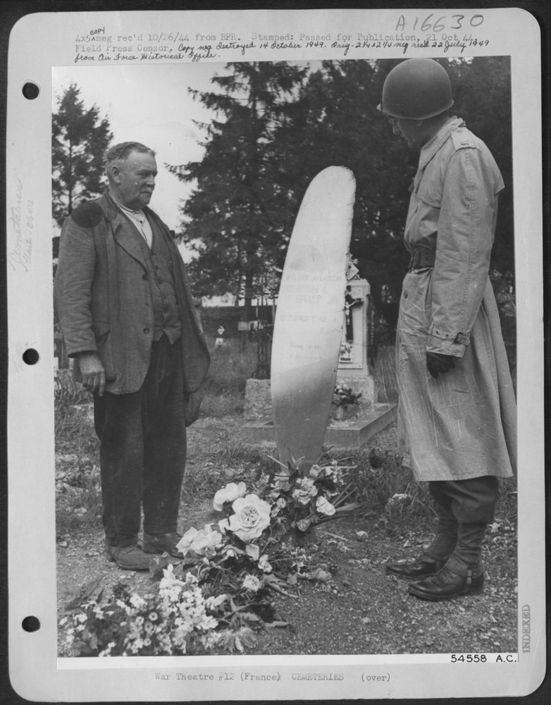 An American officer visits the grave of Lt. Houston L