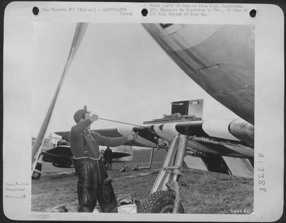 An Eighth Fighter Command North American P-51 Mustang armorer cleans