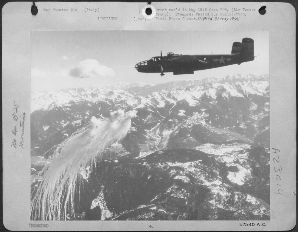 Anti-flak bombs bursting near B-25 Mitchell