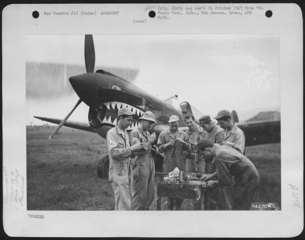 Armorers assemble P-40 guns at Peishihwa