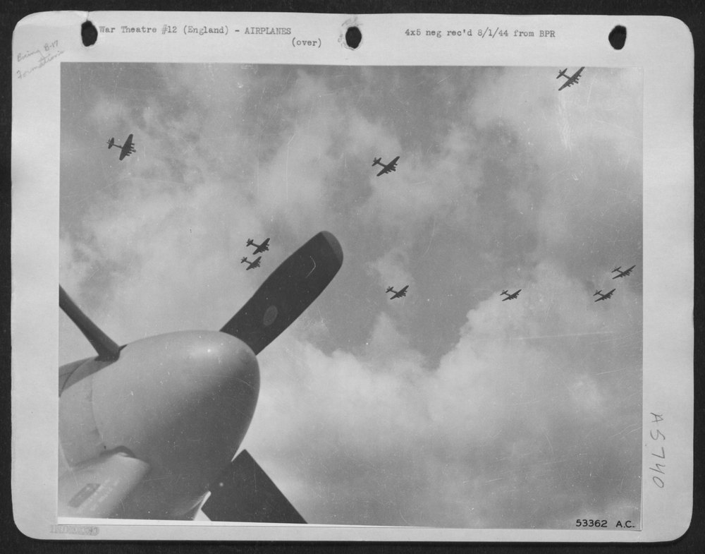 Boeing B-17 Flying ofrtresses lumber over North American P-51 Mustang