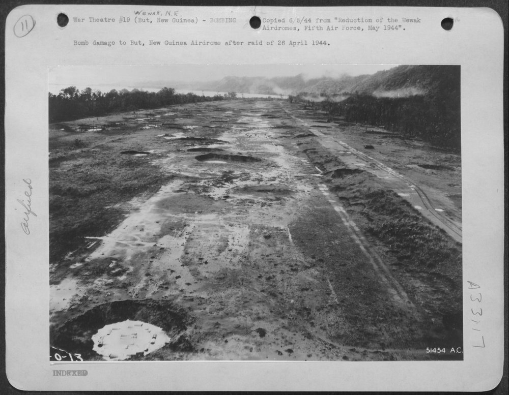 Bomb damage at But New Guinea Airdrome