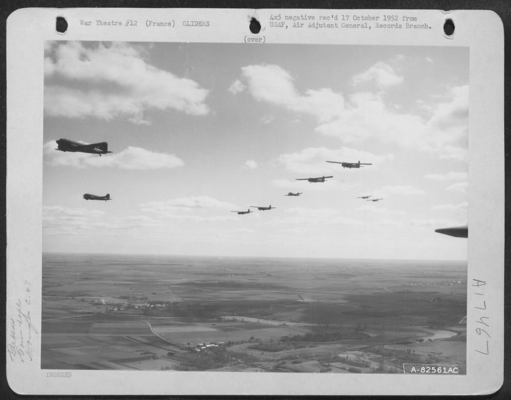 C-47S towing gliders over France