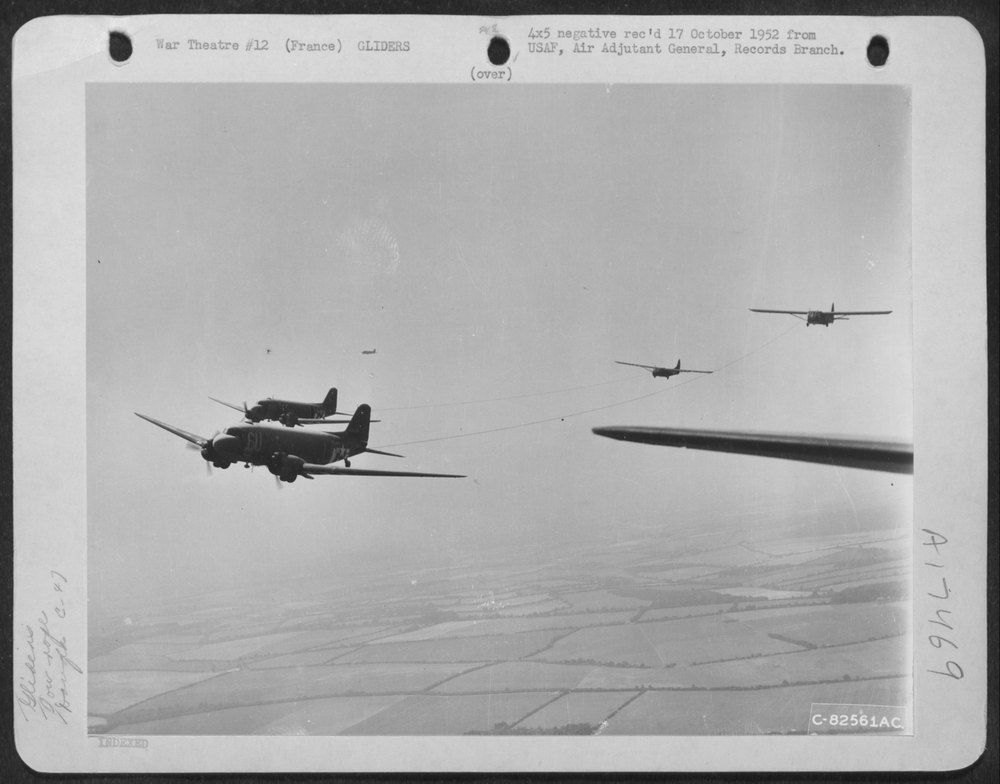 C-47S towing gliders over France