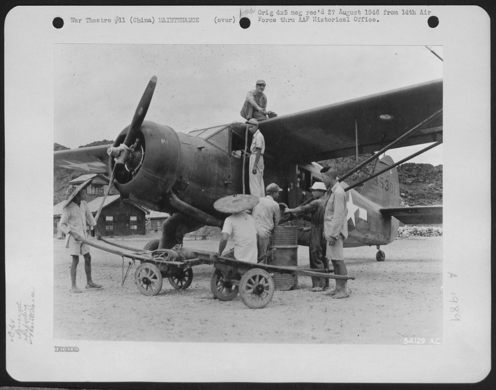 Chinese coolies service plane at 14th Air Force base