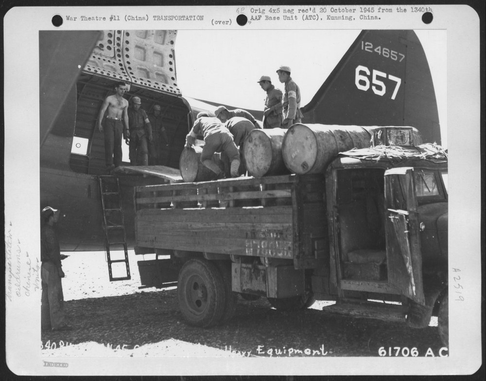 Chinese Workers Load Drums Kunming
