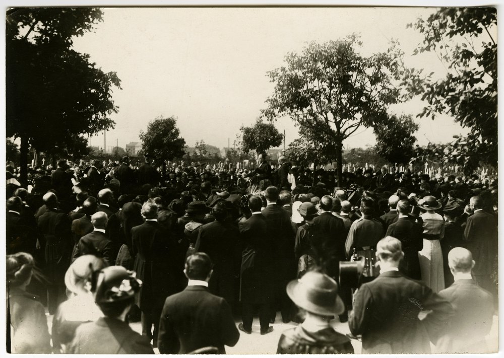 Clergy address crowd in cemetery