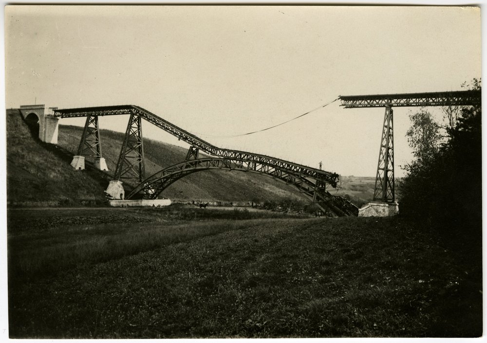 Collapsed metal truss bridge on Stresbee