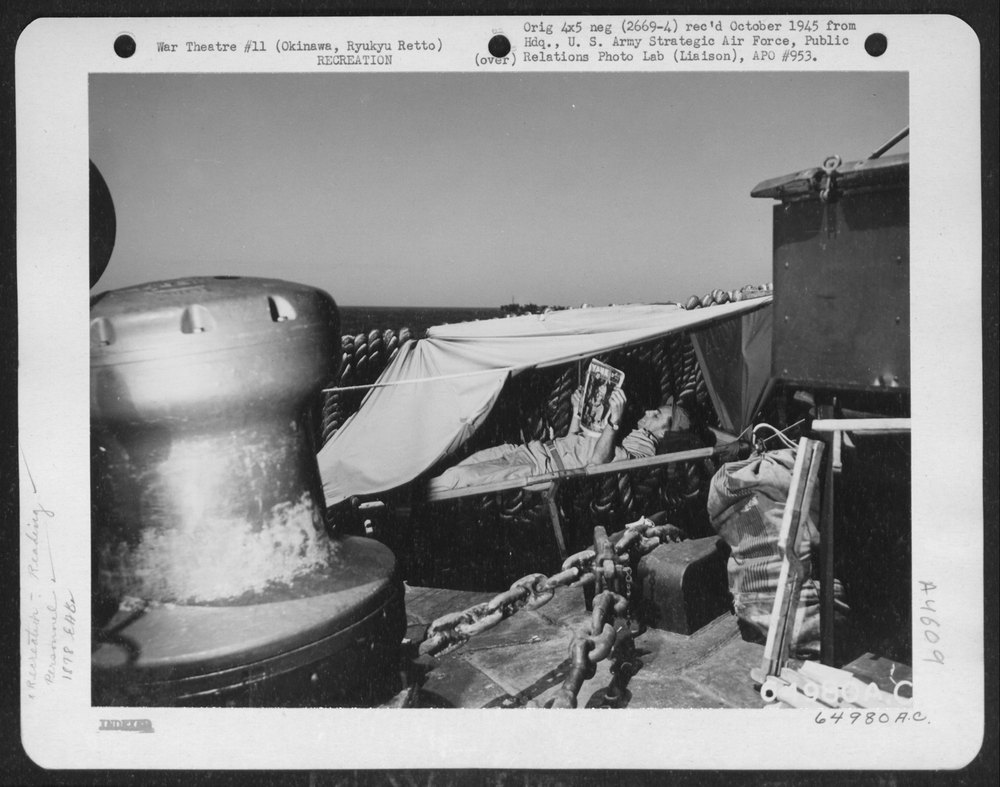 Collins reads Yank on ship to Okinawa