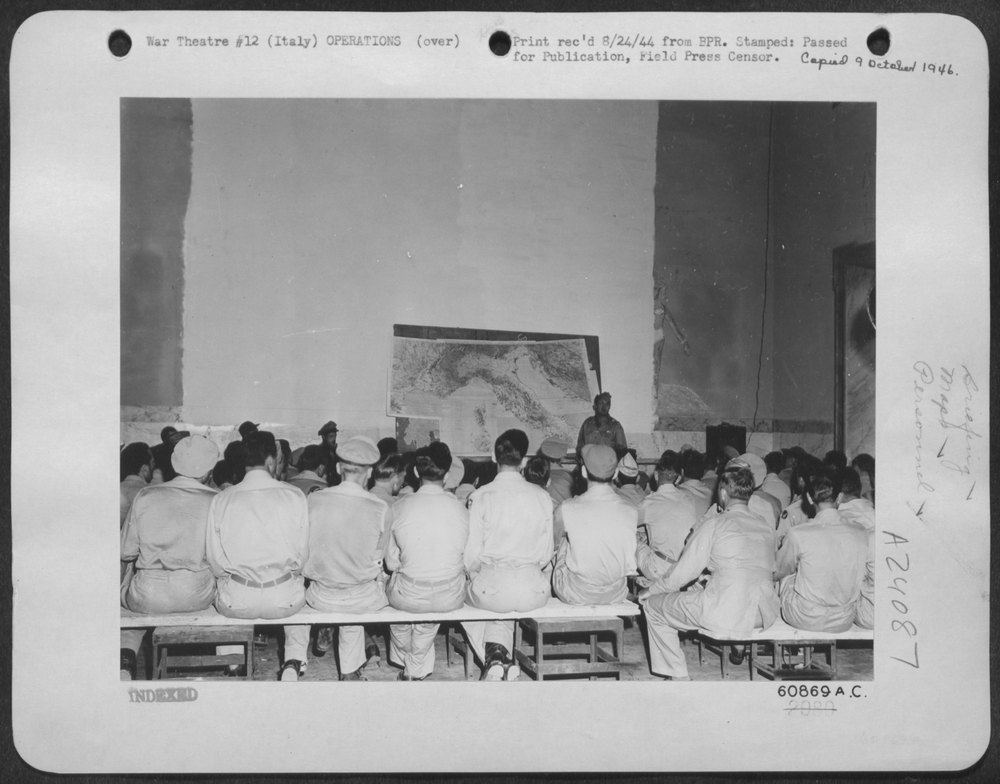 Colonel John Cerny briefs pilots in Italy