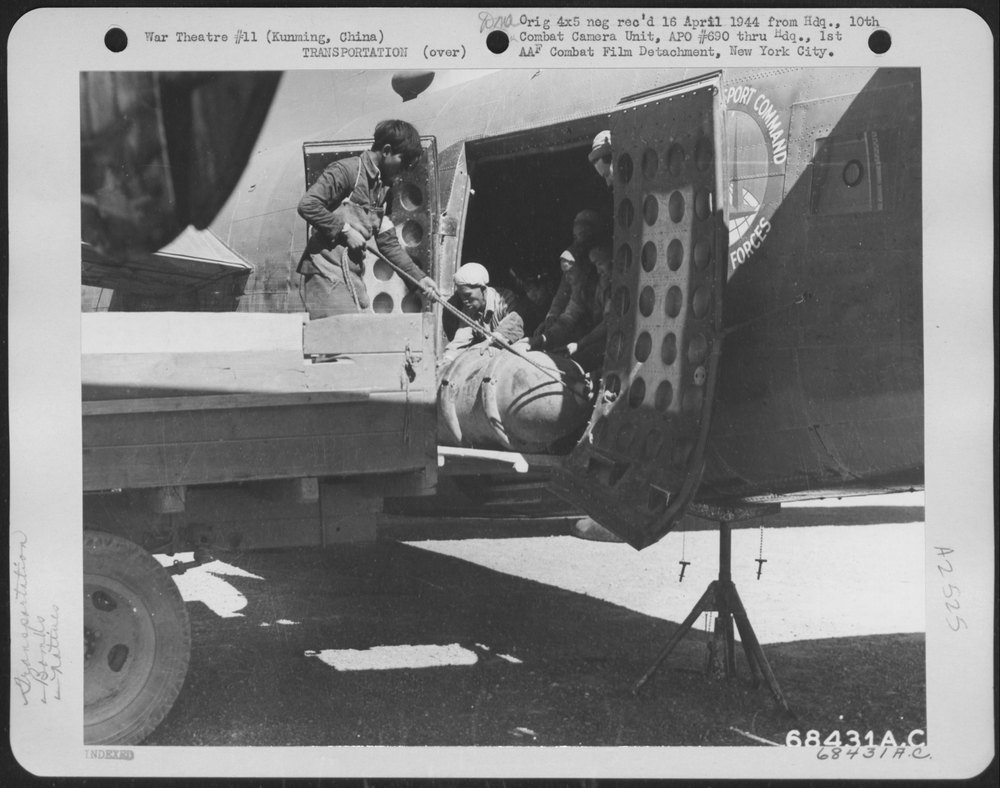 Coolies unloading bombs at Kunming