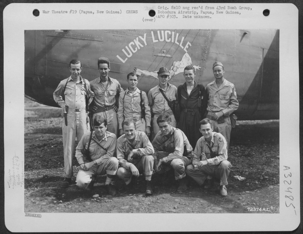 Crew with B-24 Lucky Lucille at Dobodura