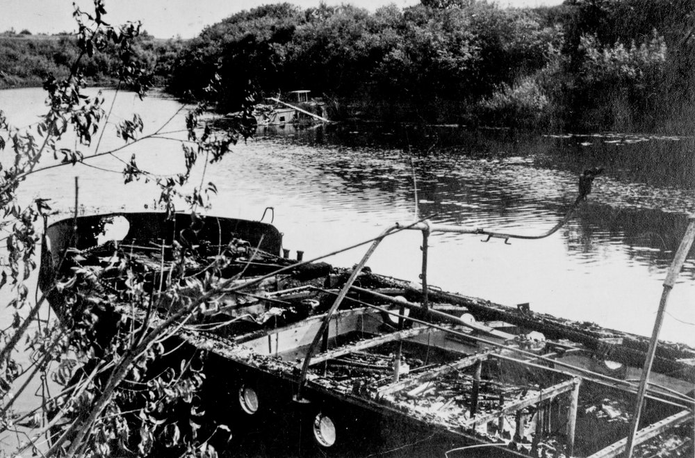 Destroyed boat on the river Dnieper