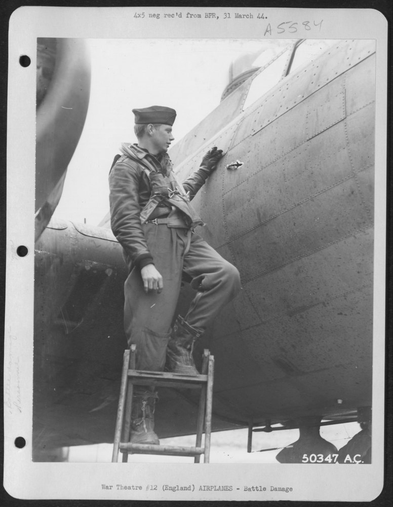 England-2nd Lt. Manuel A. Pidcock of Chandler, Oklahoma, is examining