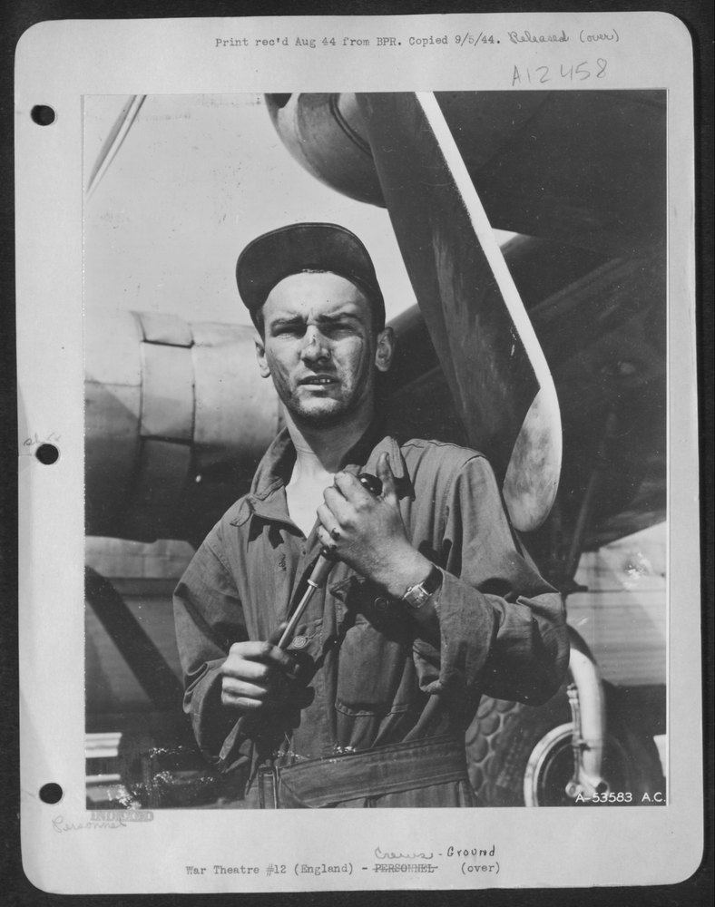 England-Sgt. Arthur Dwyer, ground crew member of a B-24, is a very