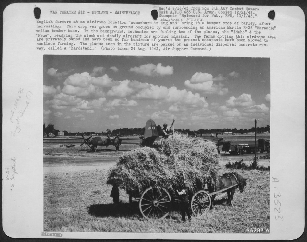 English farmers at an airdrome location 'somewhere in England' bring