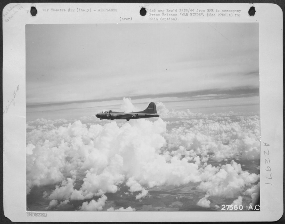 Flying Fortress over Italian landscape