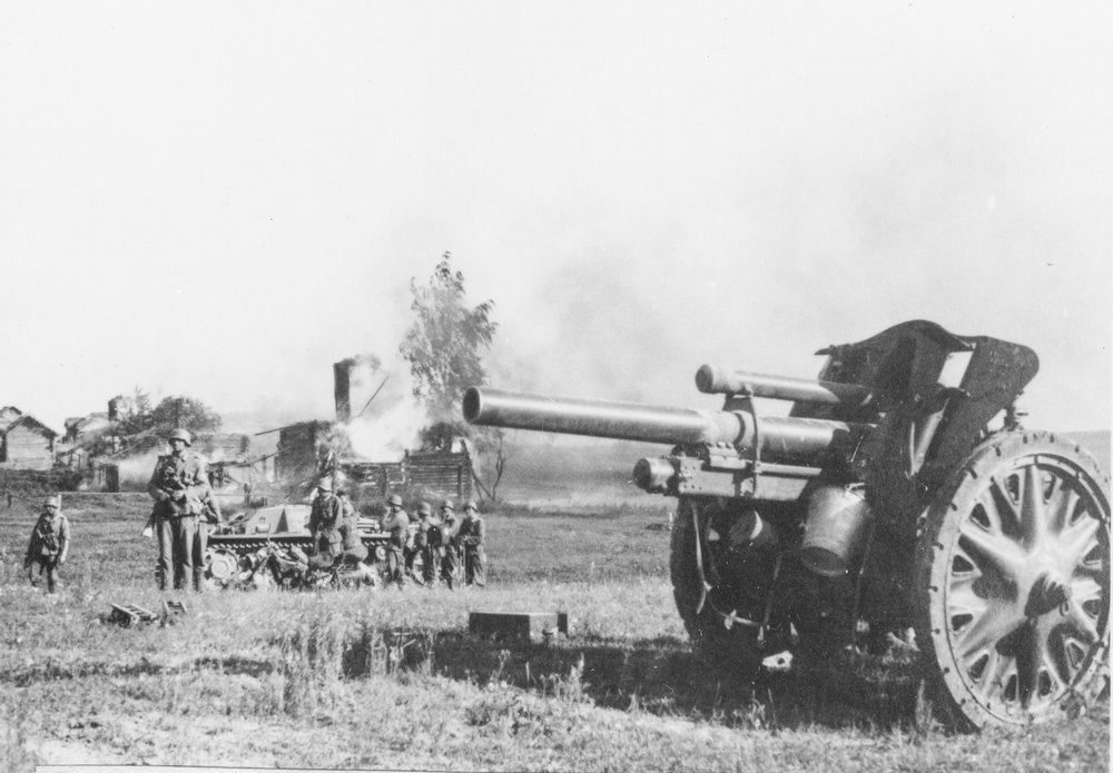 German field gun and advance units proceeding ahead of troops