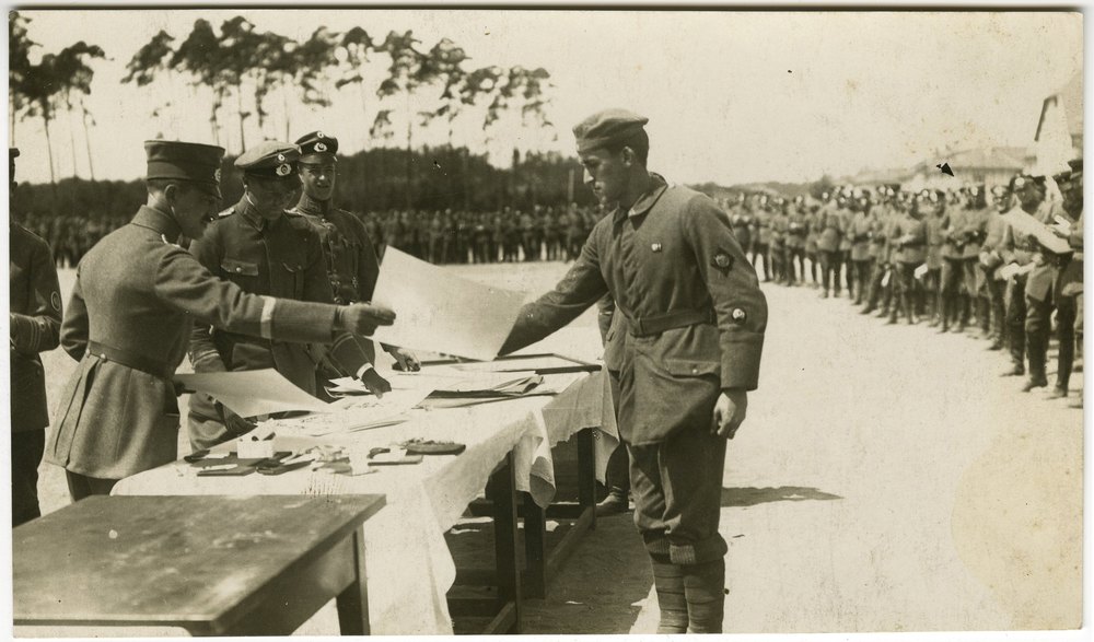 German troops gathered around a table outdoors