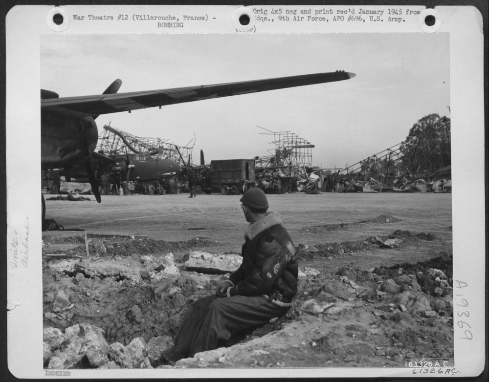 GI in bomb crater at Villarouche