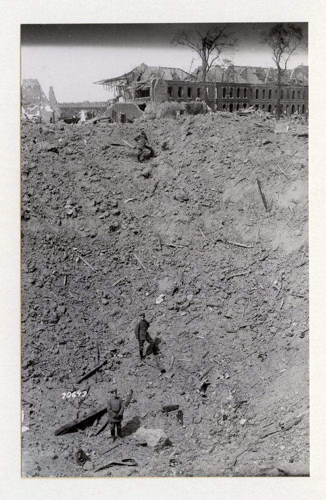 Giant shell crater in a captured French village, caused by a German airplane bomb