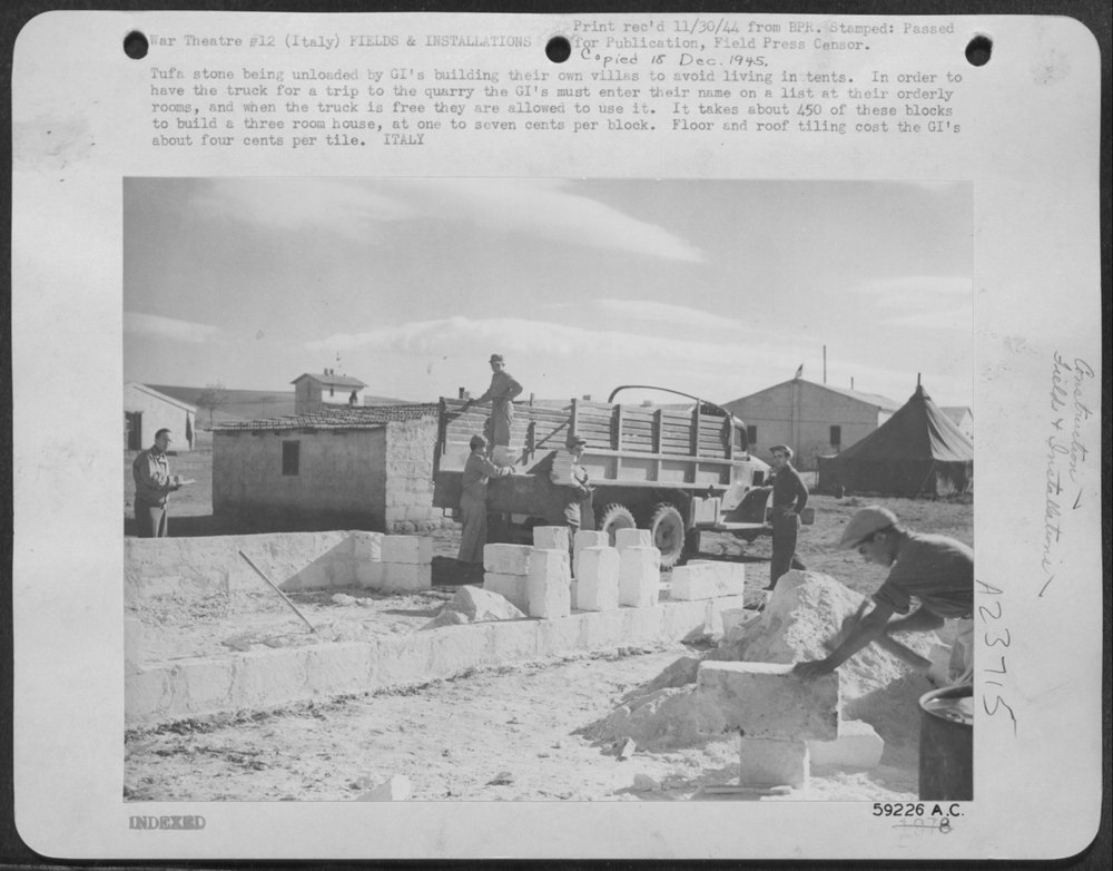 GIs unloading tufa stone