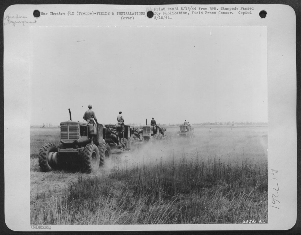 Graders levelling runway area