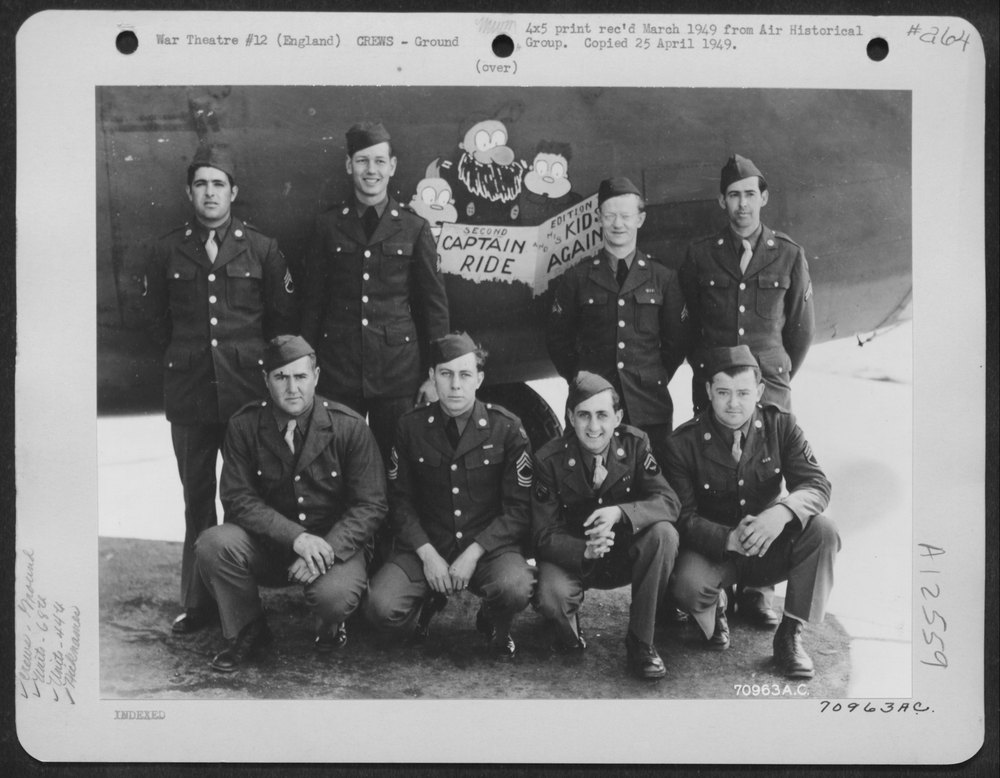 Ground crew with B-24 Liberator in England