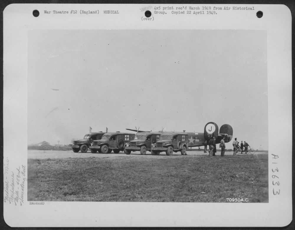 Having parked their ambulances near the runway, medical men 'sweat