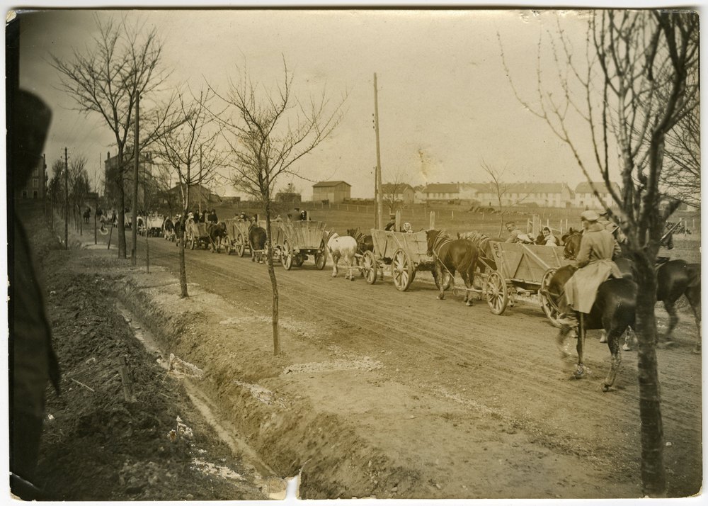 Horse-drawn carts transport French civilians