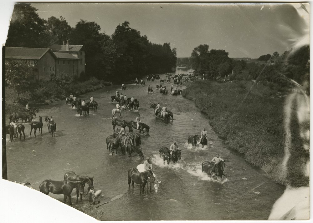 Horseback riders crossing a river near Baccarat