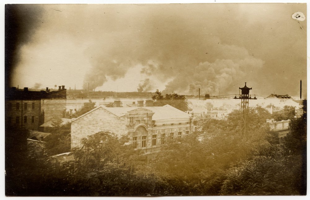 Industrial town with gabled building and wooden tower
