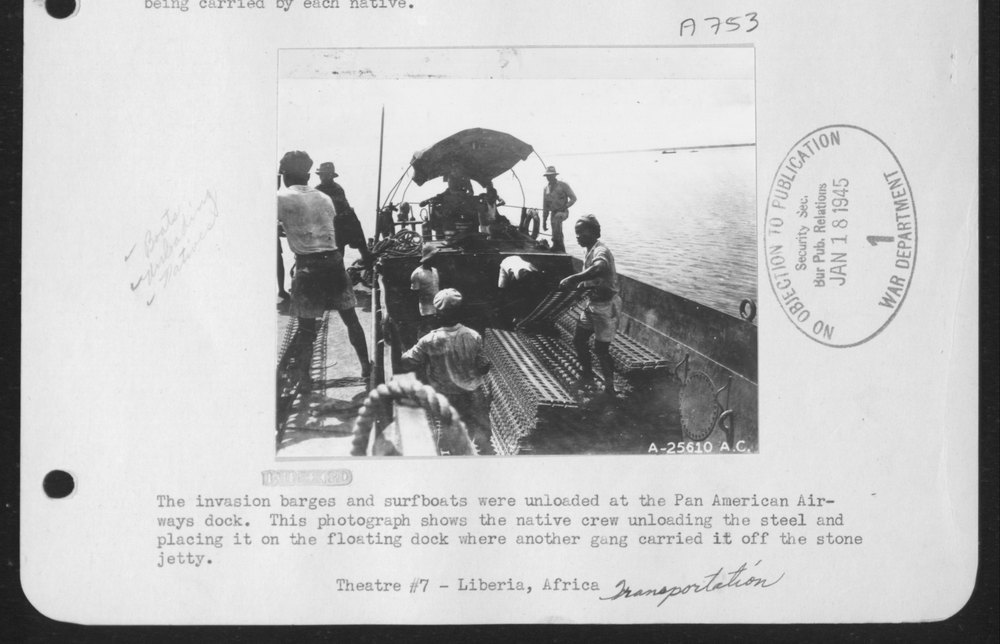Invasion barges at Pan American Airways dock