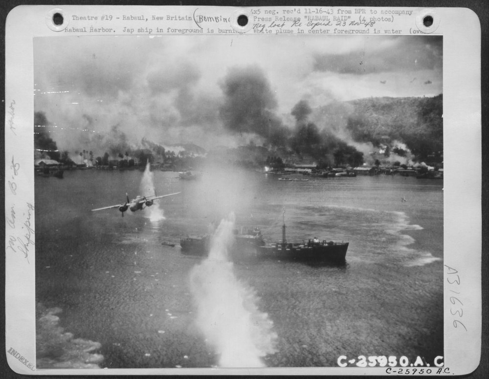 Jap ship in foreground is burning