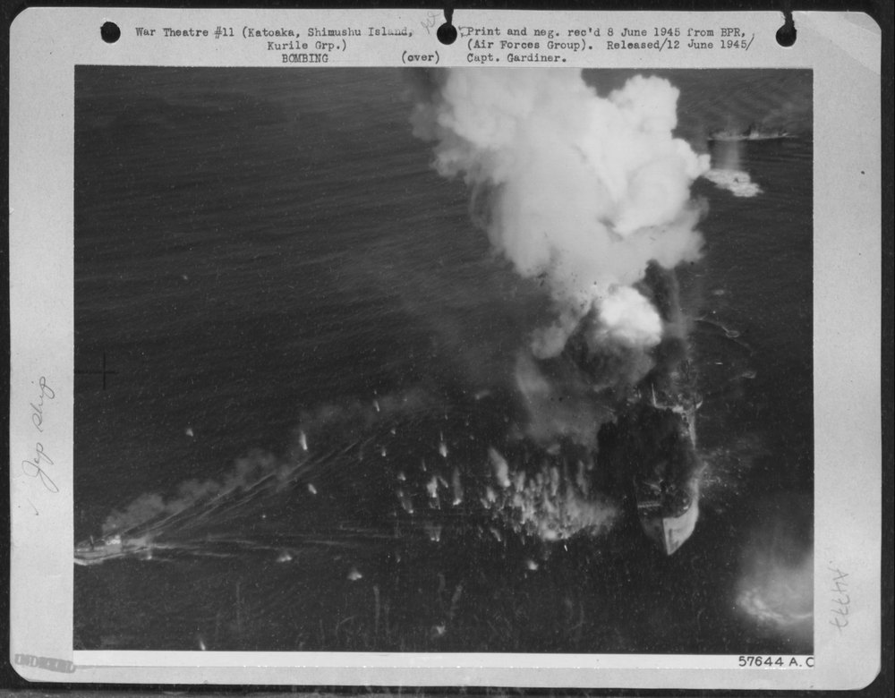 Japanese Cargo Ship Burning At Katoka Naval Base