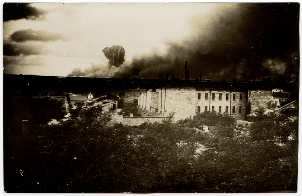 Landscape with stone building and smoke