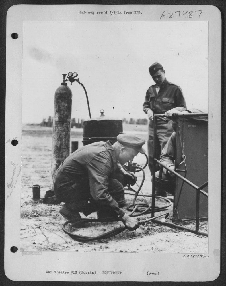 Lt Kuczynski welds at US airdrome