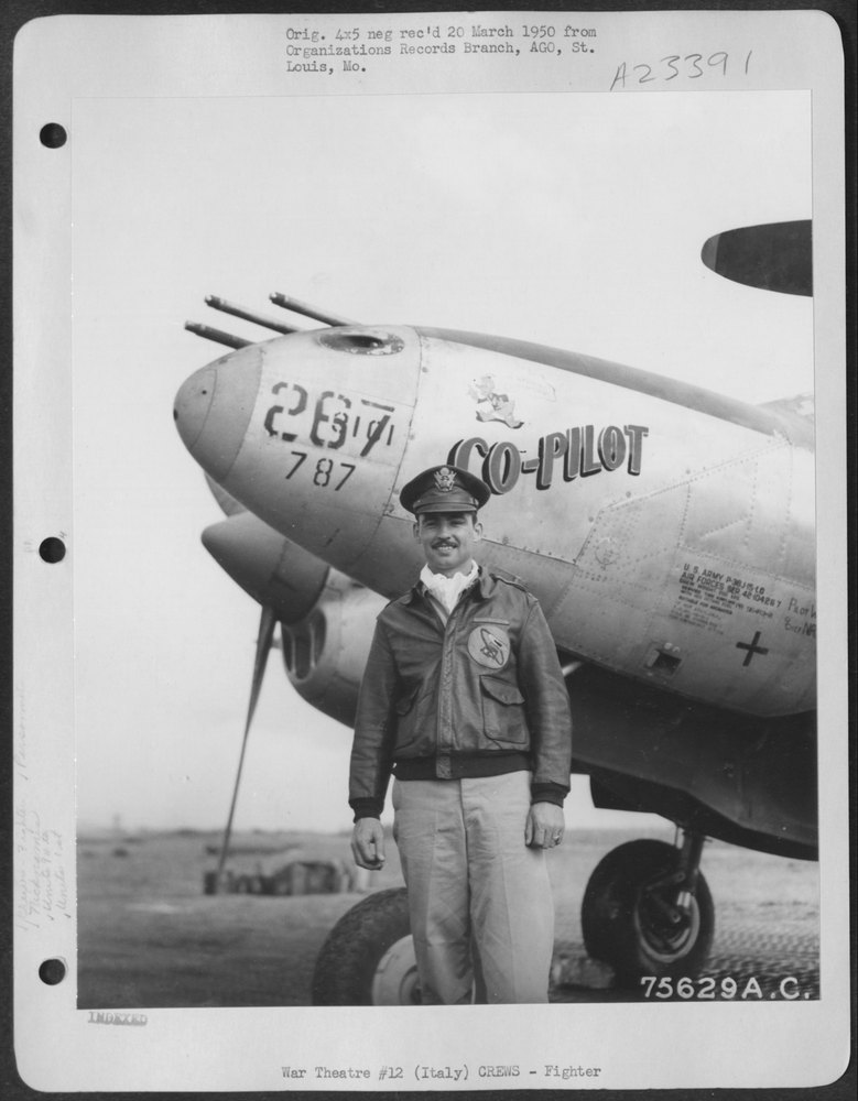 Lt Osgood beside P-38 in Italy